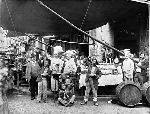 Images Dated 12th October 2011: Neapolitan pasta vender with a group of youth and cooks