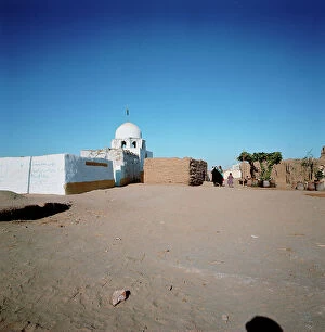 Images Dated 11th October 2011: Nubia collecting water bottles at the entrance of a village