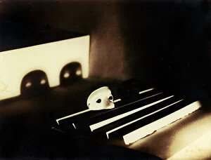 Images Dated 12th December 2011: 'Ombre (shadows)': mask set on a piece of paper folded into a fan