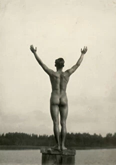 Images Dated 14th April 2010: Outdoor portrait of a naked man from behind with his arms to the sky