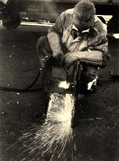 Images Dated 24th March 2011: 'Oxy-hydrogen flame'. Portrait of a worker using the oxy-hydrogen flame from which sparks