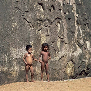 Images Dated 31st May 2007: A pair of children in front of the bas-relief featuring The Penance of Arjuna or The Descent of