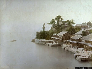 Japan: Panorama of a fishing village in Japan. In the foreground humble houses overlooking the sea