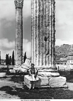 Images Dated 11th April 2012: Picture taken from the Olimpeion; in the foreground is a man with traditional Greek garments