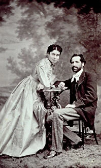 Images Dated 23rd November 2009: Portait of a young couple. The man is seated and the woman is leaning on a table
