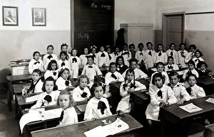 Images Dated 13th May 2011: Portrait of a female class, sitting on the desks of the classroom