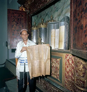Images Dated 31st May 2007: Portrait of a man showing the rolls of the Torah, Jewish community of Cochin, state of Kerala