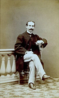 Images Dated 13th April 2011: Portrait of man sitting; cigar in hand