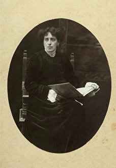 Images Dated 3rd May 2011: Portrait of a woman holding a book