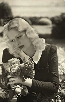 Images Dated 4th December 2009: Portrait of a woman with a rose