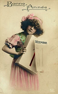 Images Dated 18th September 2007: Portrait of a young girl carrying a calendar in her hands, Christmas greeting post-card with a