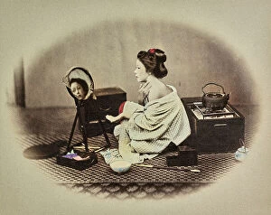 Featured Collection: Portrait of a young japanese woman putting on her make-up