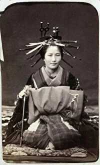 Images Dated 25th November 2011: Portrait of a young Japanese woman in traditional costume