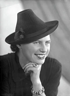 Images Dated 30th May 2006: Portrait of a young woman with a hat and jewelry