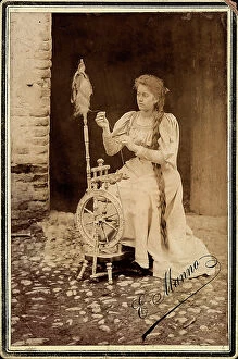 Images Dated 15th September 2010: Portrait of a young woman spinning wool