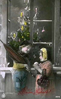 Images Dated 19th September 2008: Postcard with a Christmas theme. Two children in modest winter clothes are posing with a window in