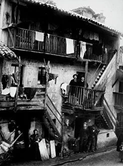 Images Dated 16th March 2009: A ramshackle residency in a poor quarter. A few people are shown on one of the wooden balconies