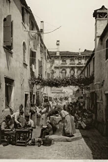 Images Dated 16th December 2010: Scene of daily life in a venetian calle: shoemakers at work and women conversing