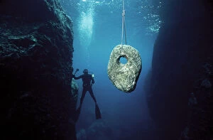 Images Dated 13th June 2008: On the sea bottom of the Island of Ventotene, recovery of a stone anchor probably dating to