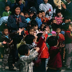 Images Dated 27th October 2009: Shanghai. A colorful crowd of children in the public gardens