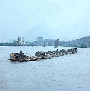 Images Dated 26th October 2009: Shanghai. Junks and barges on the Yangtse River, at the entrance of the port of Shanghai