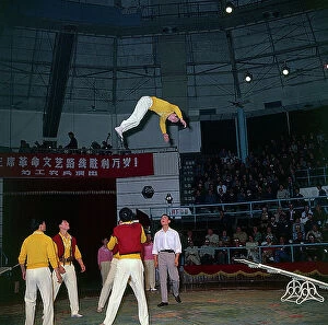 Images Dated 23rd October 2009: Shanghai. The streets. In a circus theatre a group of acrobats perform a difficult balancing act