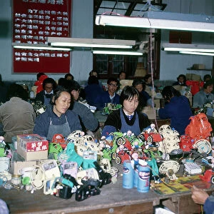 Images Dated 27th October 2009: Shanghai. Women at work in a small factory