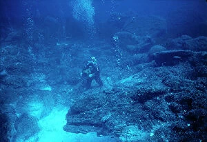 Images Dated 6th November 2009: Sicily. Aeolian Isands. Folco Quilici immersed in photographing the mouth of a volcano under water