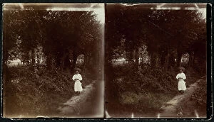 Images Dated 15th November 2011: Small girl shown along a path through a wood