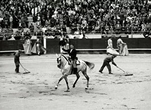 Images Dated 14th April 2011: Snapshot of a bullfight. In the center a man on a horse greets the audience in the rows of the arena
