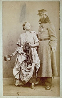 Images Dated 2nd November 2011: Studio portrait of a Russian soldier next to a woman dressed in simple work clothes