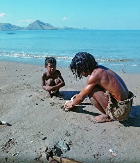 Images Dated 14th July 2011: Sunda Islands, Flores Island, Father and son on a beach