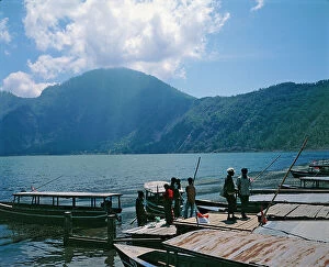 Images Dated 7th September 2011: Sunda Islands. Island of Bali. Shores, fishermen and boats on the shores of Lake Catur