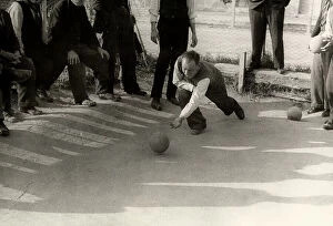 Images Dated 6th May 2011: 'The game of bocce'. A bocce player photograph at the moment of releasing a ball