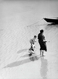 Images Dated 3rd December 2010: 'Their world'. Woman and children at the seashore