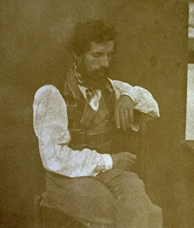 Images Dated 16th November 2009: Three-quarter-length portrait of a seated man. He is looking downwards