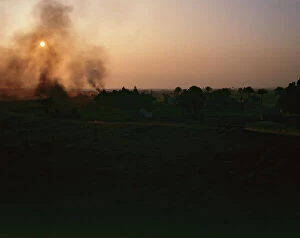 Images Dated 11th October 2011: Upper Egypt, Dandara at sunset with the smoke of the fire small ceramic factories