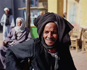 Images Dated 12th October 2011: Upper Egypt, Esna, an old man with a black turban in a bar outside on the street