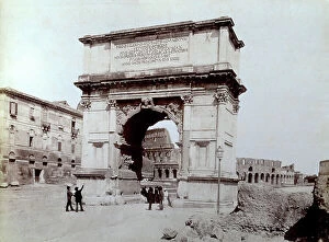 Images Dated 7th February 2012: View of the Arch of Titus with the Colosseum in the background