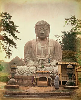 Japan: View of the Great Buddha Daibutsu, with two monks at the foot of the statue, at Kamakura, Japan