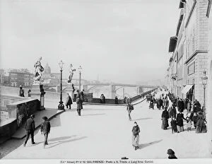 Florence Collection: View with people of Lungarno Corsini and a small part of the Santa Trinita Bridge