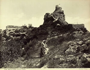 Images Dated 24th March 2010: View of the Tower of Tiberius in Capri. In the foreground is a woman in traditional dress