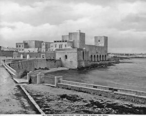 Images Dated 6th April 2012: View of Trani Castle in Puglia. The part along the sea is visible with passersby