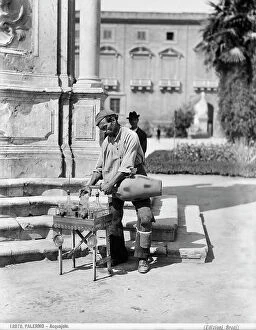 Images Dated 16th December 2010: A water-vendor of Palermo pours some water in a glass