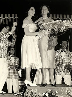 Images Dated 24th March 2011: The winner of the 'Miss Tuscany' beauty pagent, smiling as she recieves flowers and her title
