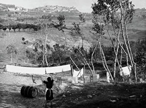 Images Dated 11th April 2011: Woman hangs clothes out to dry in the Chianciano countryside