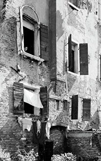 Images Dated 5th May 2010: Woman at a window, Venice