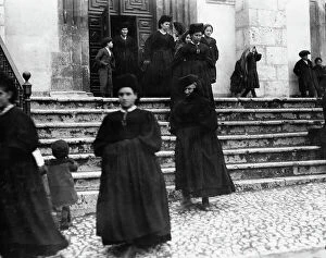 Images Dated 24th April 2009: Women in traditional dress leaving the Chiesa di Santa Maria della Valle in Scanno