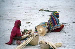 Images Dated 16th November 2009: Women weaving baskets that they will then sell on the beach