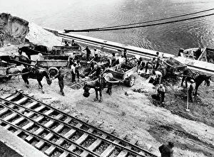 Images Dated 24th March 2011: Workmen constructing the railway near the Tuscan coastline
